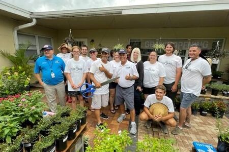 The Yard Founders and Staff Posing for a Ribbon Cutting Ceremony